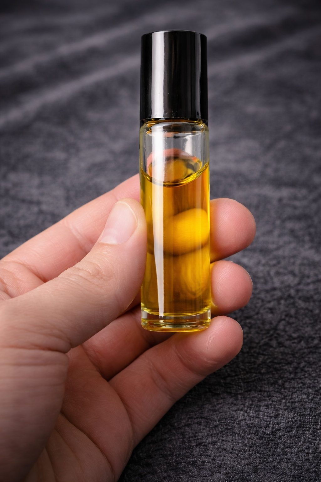 Ascend #001 held in a hand to show its 10ml size